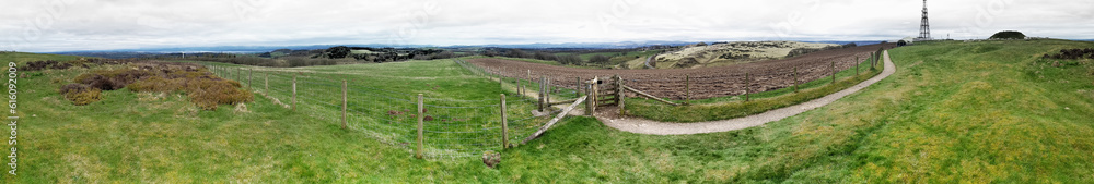 Cairnpapple prehistoric site W. of Edinburgh. Panoramic here includes R to L burial mound, Traprain Law, Fife, Firth of Forth toward Loch Lomond hills