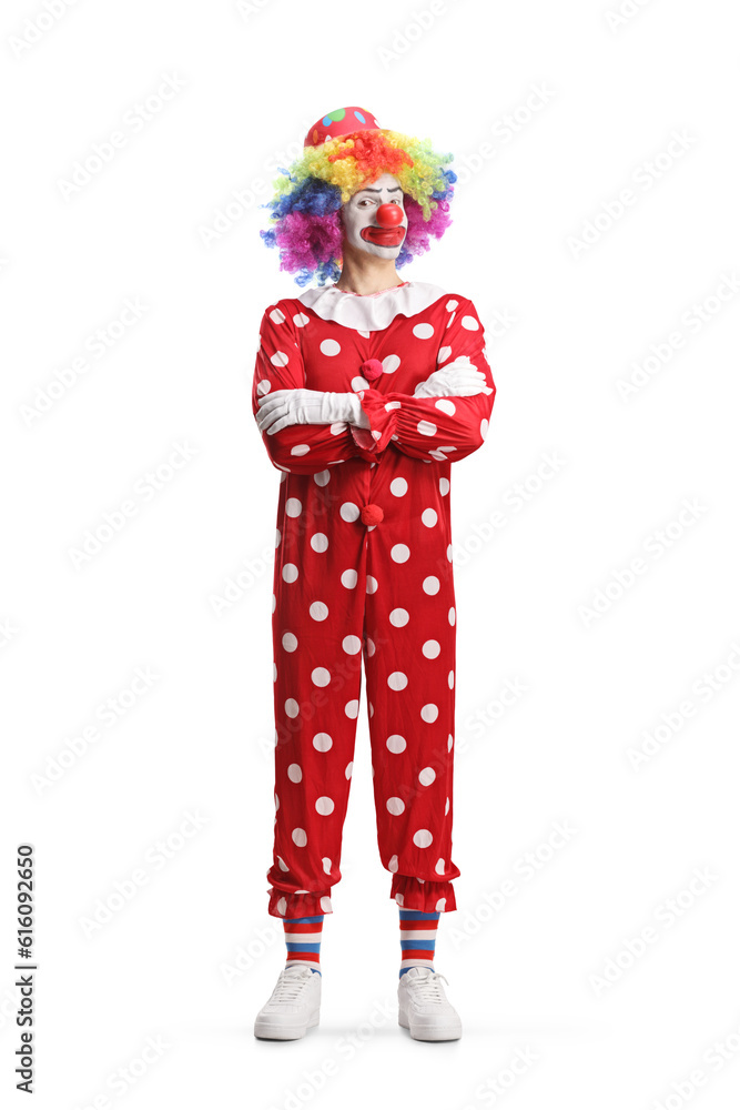 Full length portrait of a clown standing with folded arms - obrazy, fototapety, plakaty 
