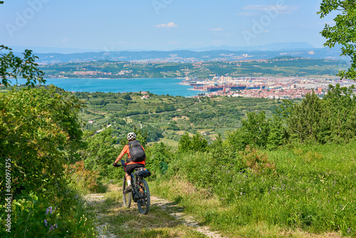 nice active senior woman on a mountain bike tour at the Slovenian Mediterranen cost above Izola