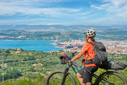 nice active senior woman on a mountain bike tour at the Slovenian Mediterranen cost above Koper at Capodistria