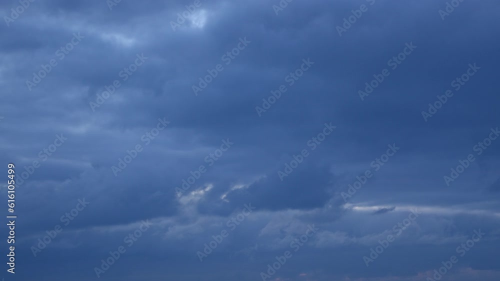 As the sun sets, the sky transforms into a canvas of blue clouds. This video timelapse captures the beauty of the evening sky. As the sun sets, the sky transforms into a canvas of blue clouds. This video timelapse captures the beauty of the evening sky.