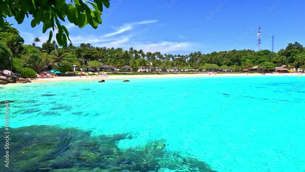 Kho Rasha island off the coast of phuket thailand by speed bias from Chalong Bay, beautiful turquoise Blue beach with white soft sand and lush green trees Kho Rasha island off the coast of phuket thailand by speed bias from Chalong Bay, beautiful turquoise Blue beach with white soft sand and lush green trees