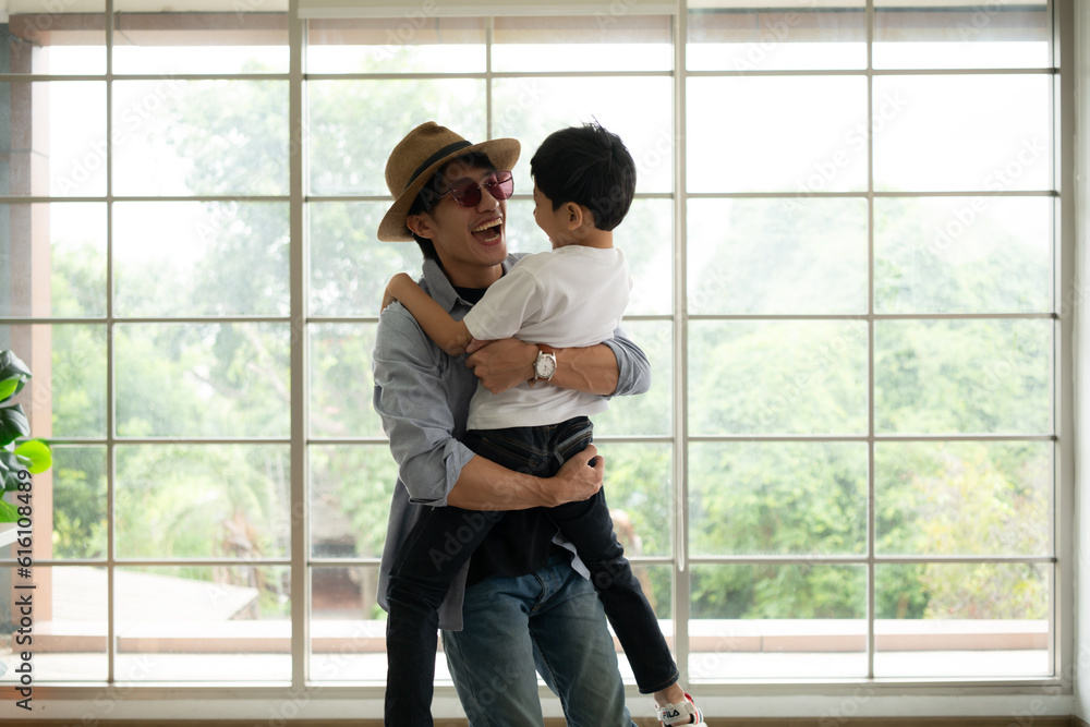 Father and son are happy and ready to travel on a weekend trip Father and son are happy and ready to travel on a weekend trip