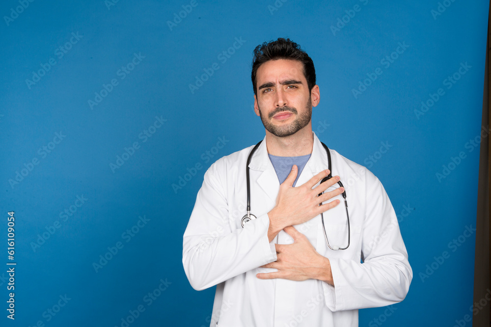 Doctor in studio with chest pain expression Doctor in studio with chest pain expression