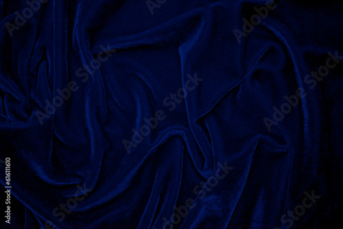 Dark blue velvet fabric texture used as background. Sky color panne fabric background of soft and smooth textile material. crushed velvet .luxury cobalt tone for silk.