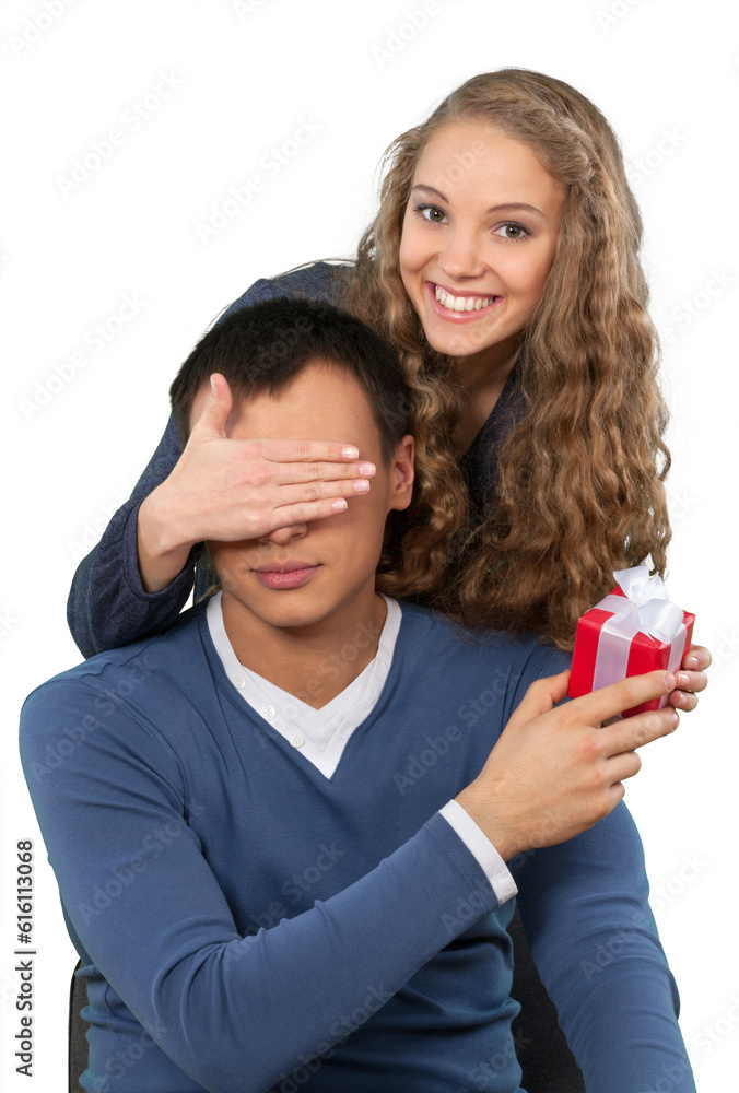 Cute young couple with gift box isolated on white background Cute young couple with gift box isolated on white background