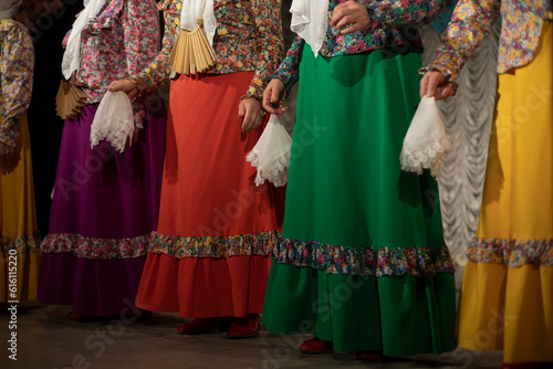 Women in folk costumes. Slavic folk costume. Folklore ensemble on stage.