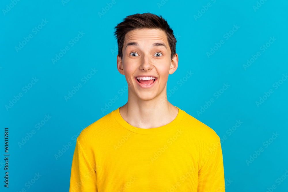 Photo of man seeing things occurring with emotions on face in shirt isolated blue color background Photo of man seeing things occurring with emotions on face in shirt isolated blue color background