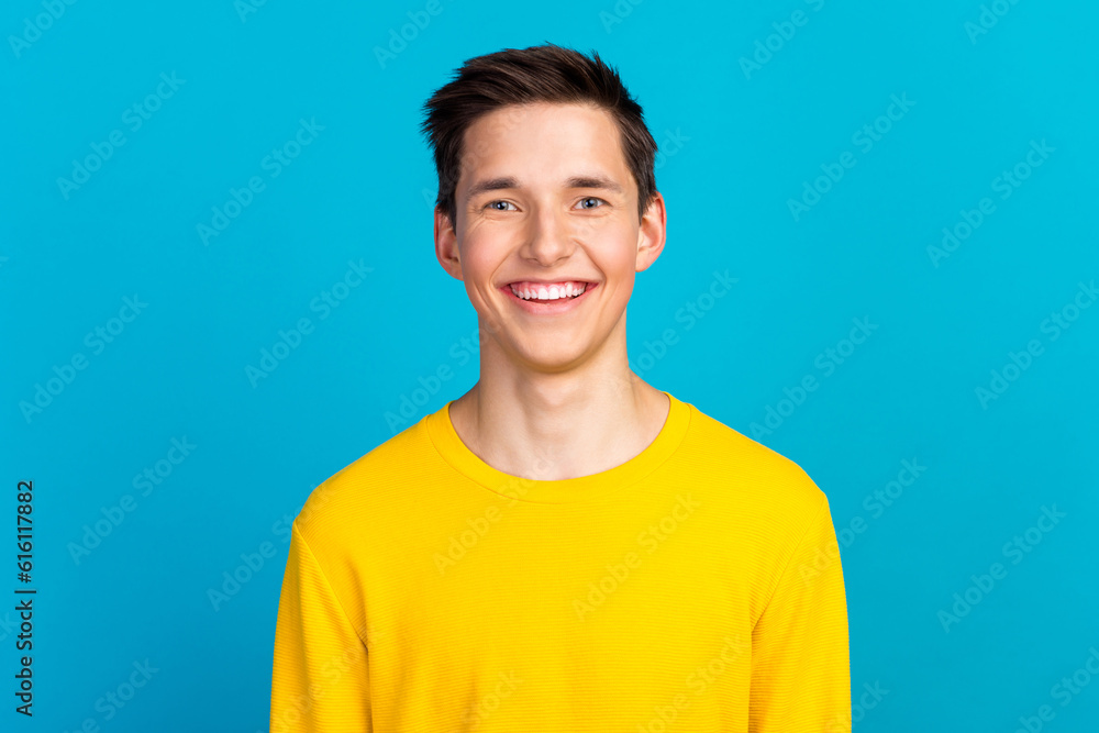 Portrait of optimistic nice man looking in camera smiling wear casual style clothes isolated on blue color background