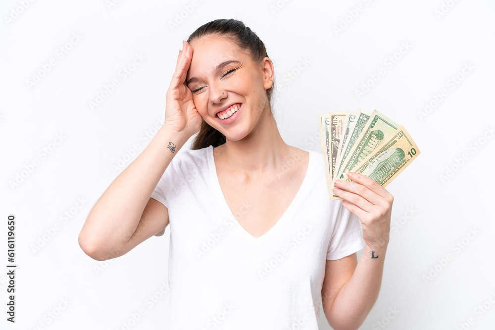 Young caucasian woman taking a lot of money isolated on white background smiling a lot Young caucasian woman taking a lot of money isolated on white background smiling a lot