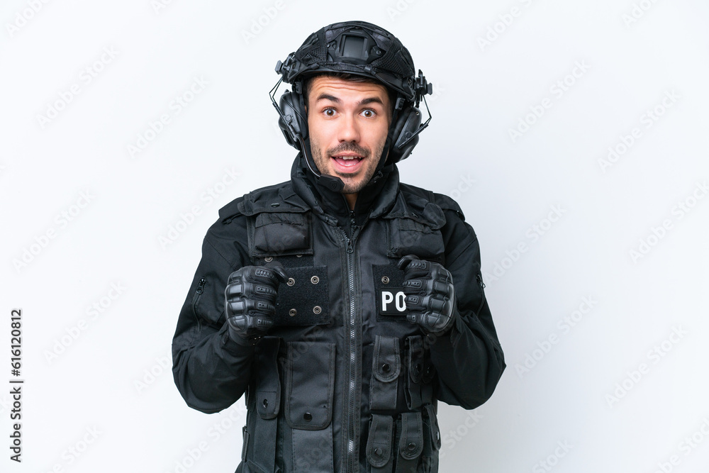 Young caucasian SWAT man isolated on white background celebrating a victory in winner position Young caucasian SWAT man isolated on white background celebrating a victory in winner position