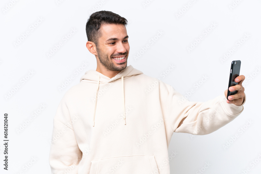 Young caucasian man isolated on white background making a selfie Young caucasian man isolated on white background making a selfie