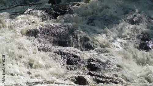 Fast flowing rapids, close up. Leivonmäki National Park, Finland. Close up. photo