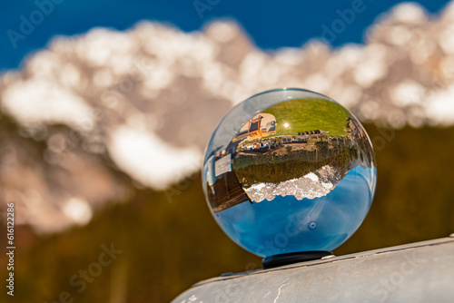 Crystal ball alpine landscape shot at the Wochenbrunner Alm, Ellmau, Mount Wilder Kaiser, Tyrol, Austria photo