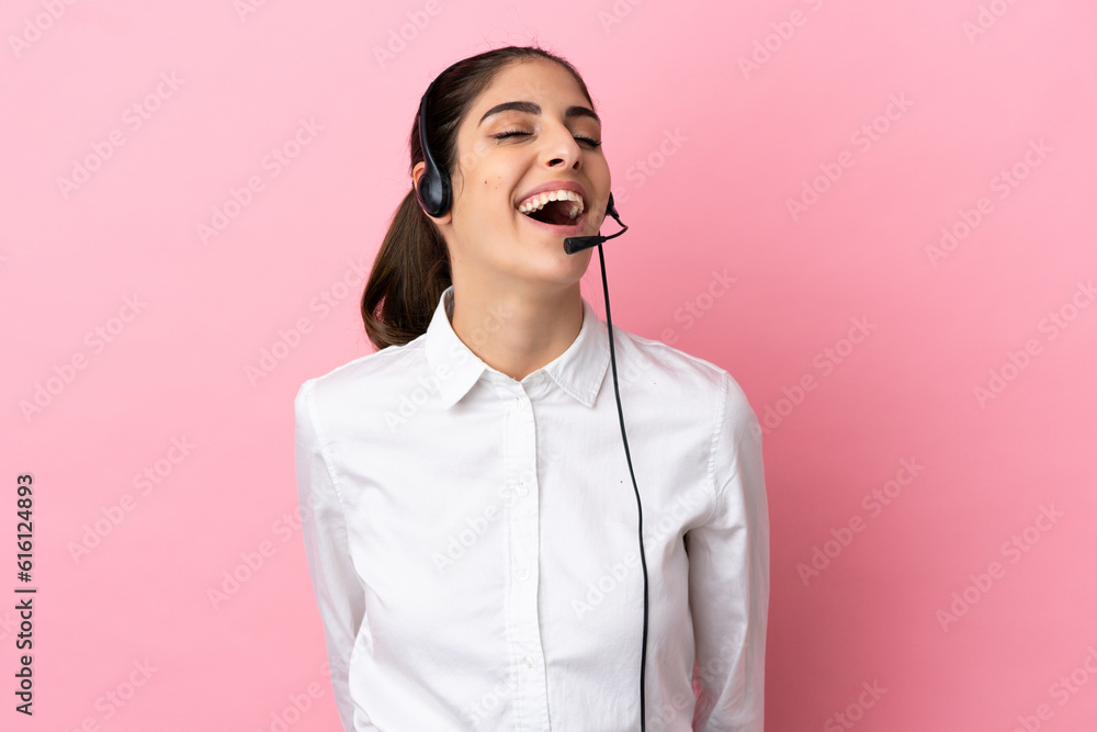 Young telemarketer over isolated background laughing Young telemarketer over isolated background laughing