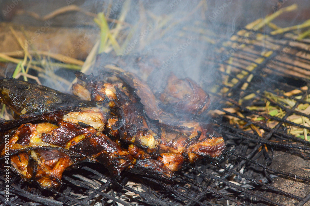 Close up portrait of burning catfish. It looks so delicious. Close up portrait of burning catfish. It looks so delicious.