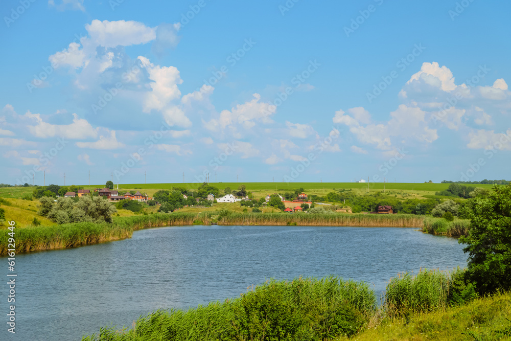 Vorskla river and Krapivnoe village in Belgorod region, Russia. Summer river landscape near the source. Vorskla river and Krapivnoe village in Belgorod region, Russia. Summer river landscape near the source.