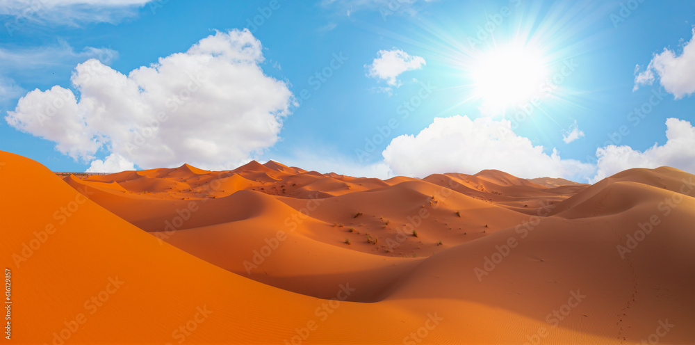 Sand dunes in the Sahara Desert, Merzouga, Morocco - Orange dunes in the desert of Morocco - Sahara desert, Morocco Sand dunes in the Sahara Desert, Merzouga, Morocco - Orange dunes in the desert of Morocco - Sahara desert, Morocco