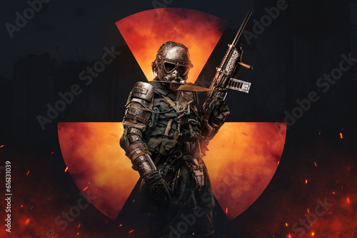 Obraz na plátně Soldier in futuristic armor, made for shielding against radiation, holds a conceptual rifle amidst blazing atmosphere