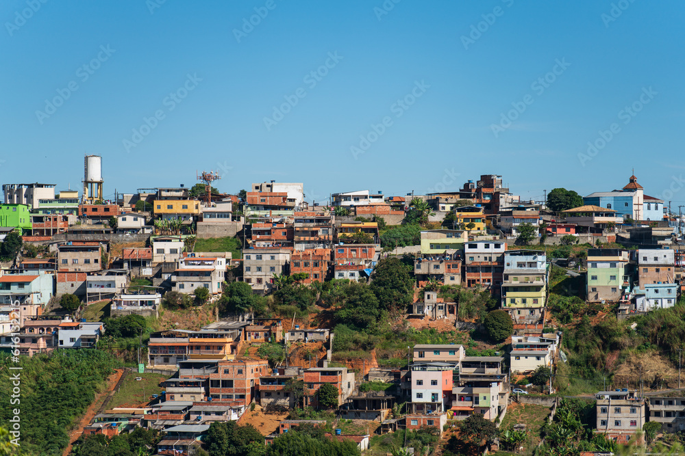 Colorful Favelas on Hillside under Clear Blue Sky with Space for Text