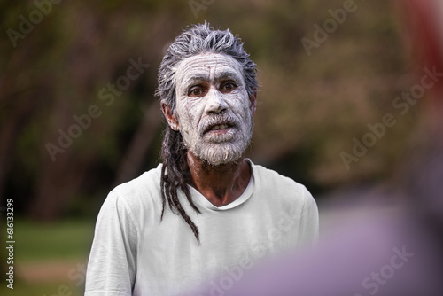 dharawal man wearing white body paint in conversation photo