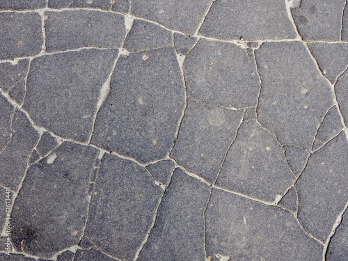Old cracked asphalt surface. Background or texture. 