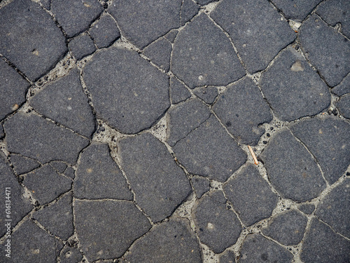 Old cracked asphalt surface. Background or texture. 