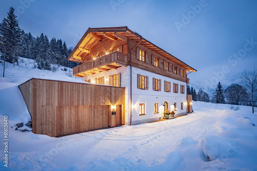Chalet house in the alps on a cold winter evening