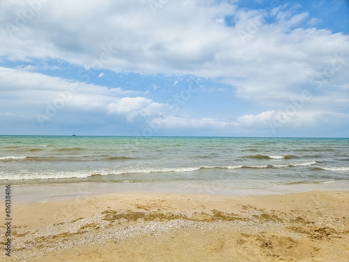 Closeup sea sand beach. Panoramic beach landscape. Inspire tropical beach seascape horizon. calmness tranquil relaxing sunlight summer mood. Vacation travel holiday.Relaxing seascape