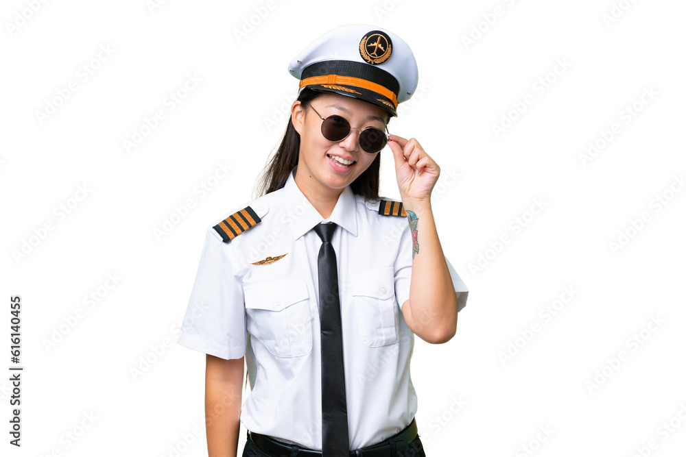 Airplane pilot Asian woman over isolated background with glasses and happy Airplane pilot Asian woman over isolated background with glasses and happy