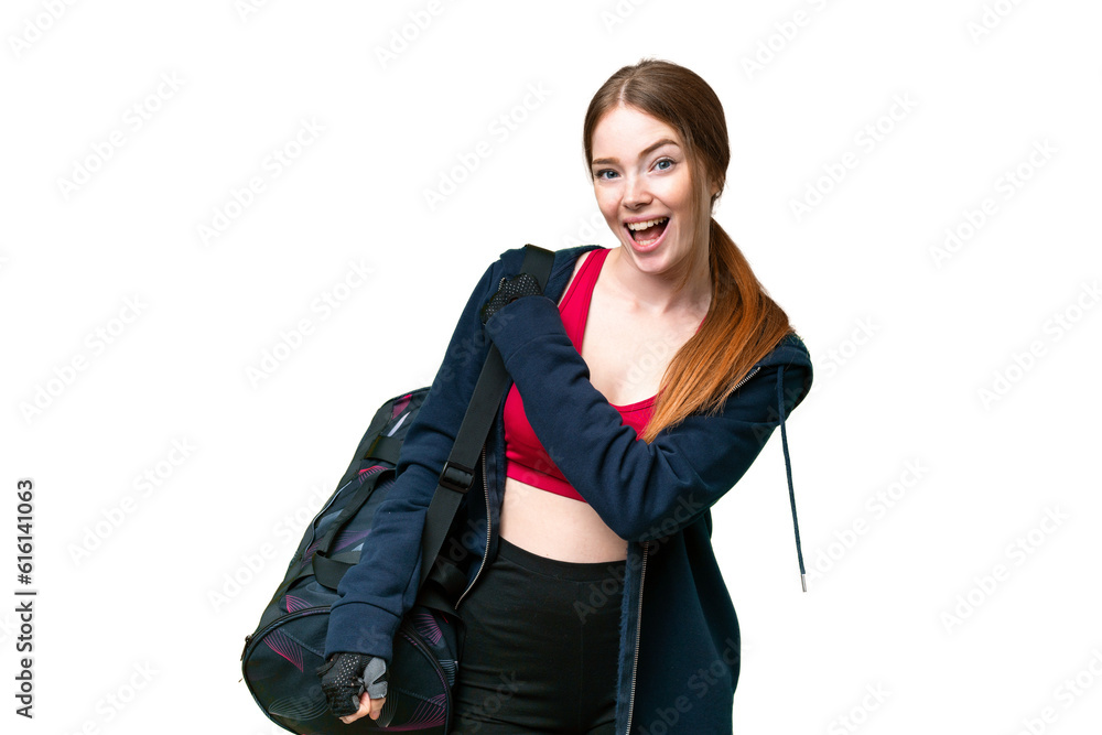 Young sport woman with sport bag over isolated chroma key background celebrating a victory Young sport woman with sport bag over isolated chroma key background celebrating a victory