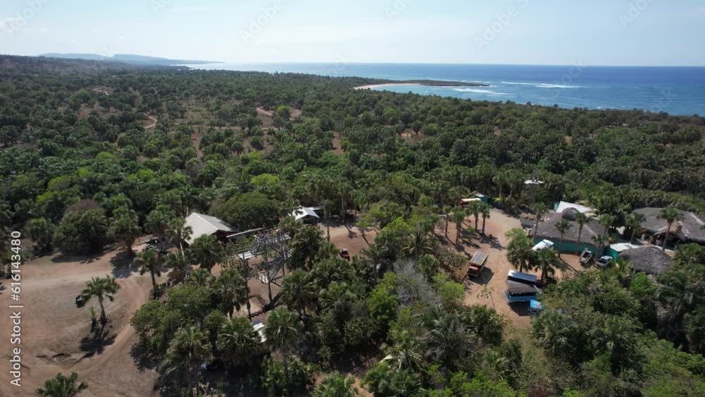 Tourists on a zip line on Punta Paitilla beach drone view Tourists on a zip line on Punta Paitilla beach drone view