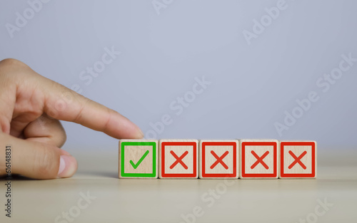 wooden block yes or no symbol and checkmark  Alternative concepts, decision making, and true and false test questions.