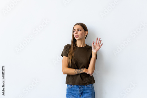 Tableau sur toile Arrogant woman shrugging raise hands look with disdain and confusion with strang