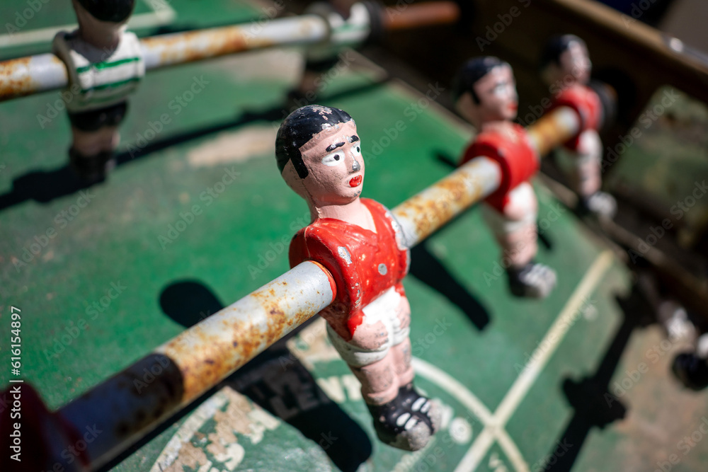 Vintage foosball table displaying Sport Lisboa e Benfica and Sporting