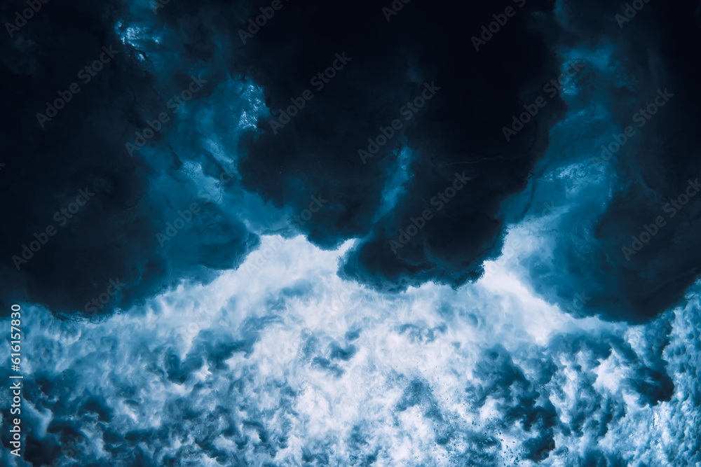 Ocean wave with foam, vortex underwater in transparent sea water.