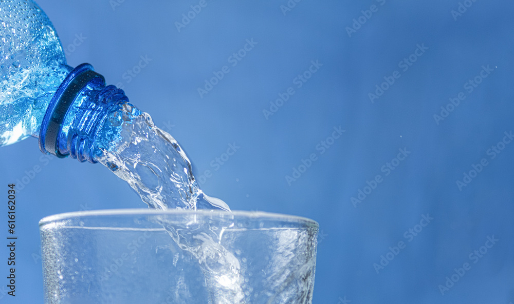 Horizontal banner with Fresh and cool water flowing from the bottle neck Horizontal banner with Fresh and cool water flowing from the bottle neck