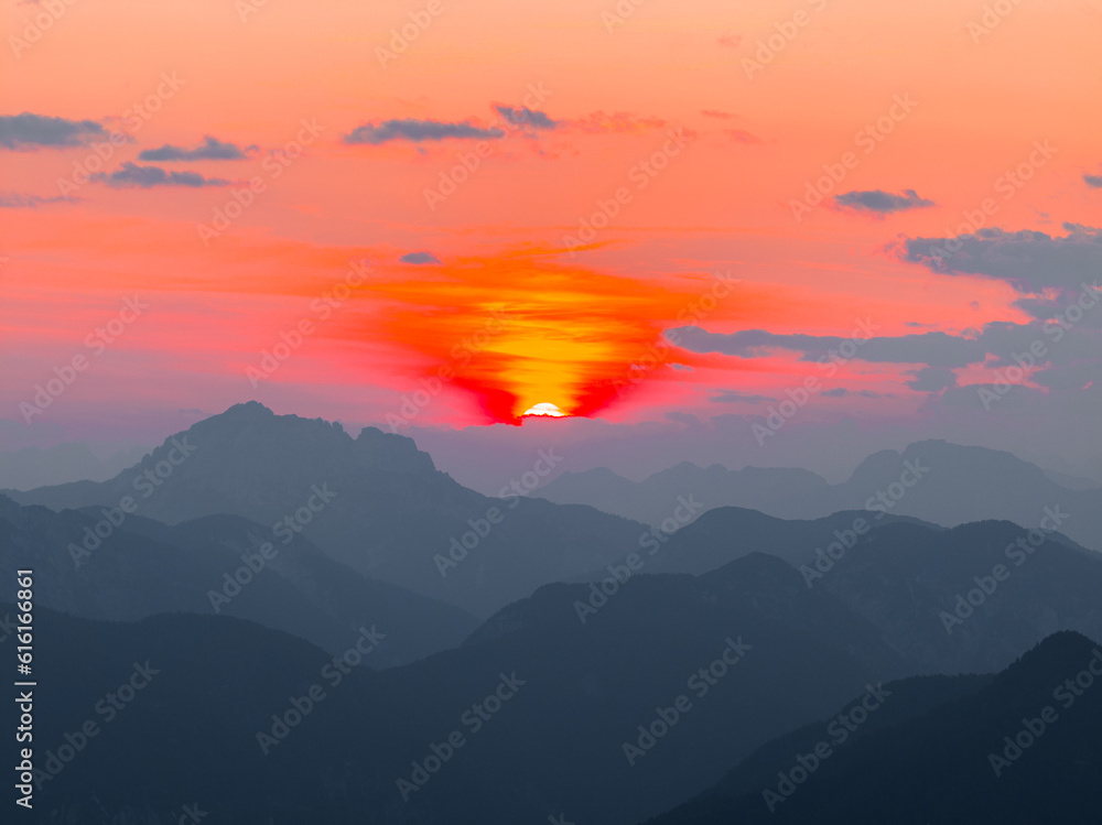 Fototapeta premium Orange Purple Sunset in the Alps in Tarvisio (Monte Lusssari) Italy