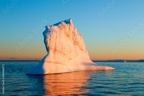 Iceberg at sunset, Greenland photo