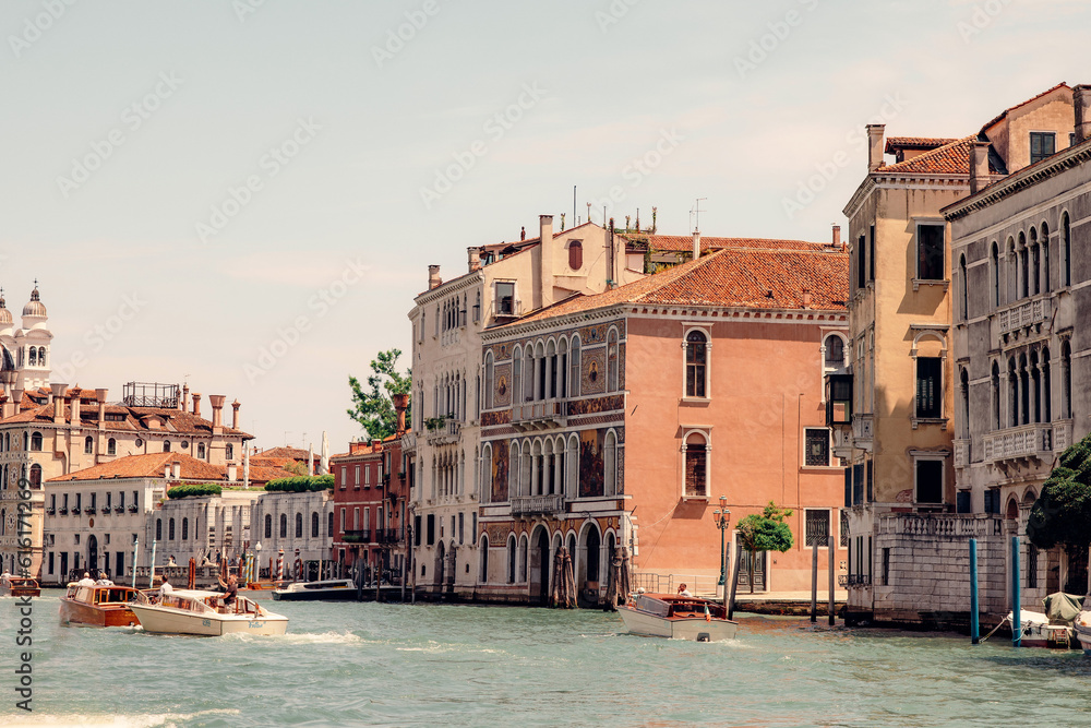 Obraz premium Venice: One of The World's Most Touristic City Revealing the Beauty of the Grand Canal with Abundance of Boats and Colorful Buildings