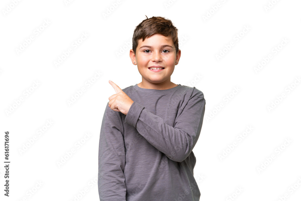 Little caucasian kid over isolated chroma key background pointing to the side to present a product Little caucasian kid over isolated chroma key background pointing to the side to present a product