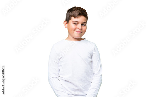 Little caucasian kid over isolated chroma key background having doubts while looking side © luismolinero