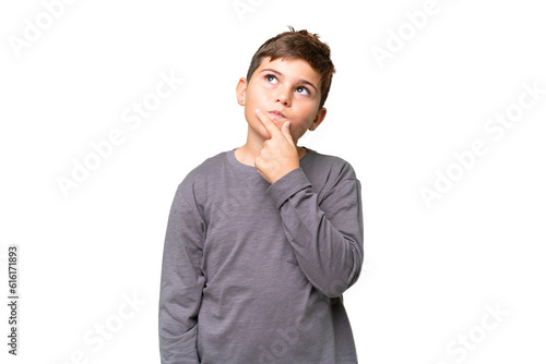 Obraz na płótnie Little caucasian kid over isolated chroma key background having doubts