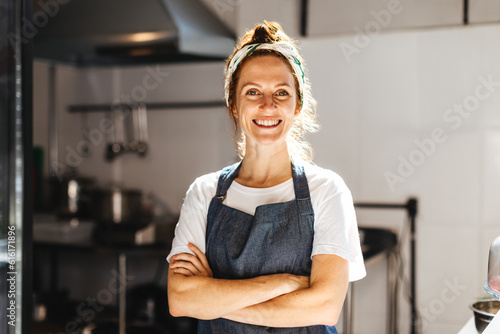 Portrait of a successful cafe owner smiling happily