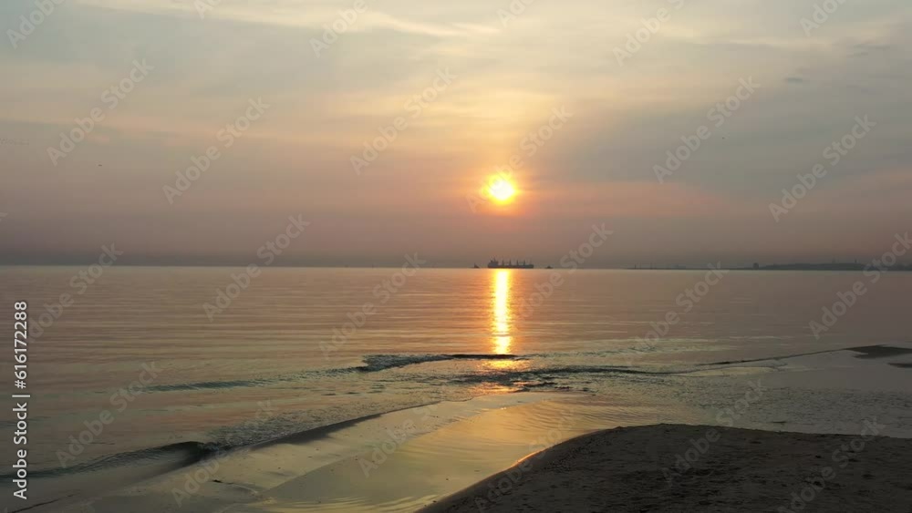 Beach of the Baltic Sea in Gdansk at sunrise. Poland Beach of the Baltic Sea in Gdansk at sunrise. Poland