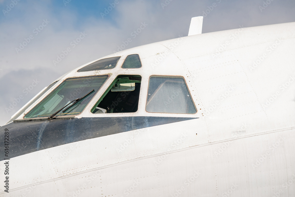 Close up view of the side of a passenger plane in the sky