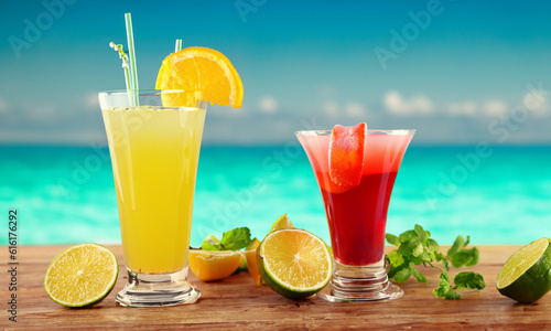 Delicious and refreshing cocktails on the beach. Glass on wooden counter with blurred sea background.