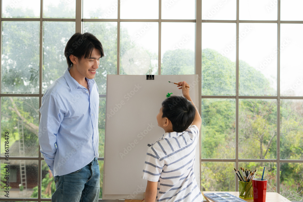 Family of artists that spend weekends at home painting with water Family of artists that spend weekends at home painting with water