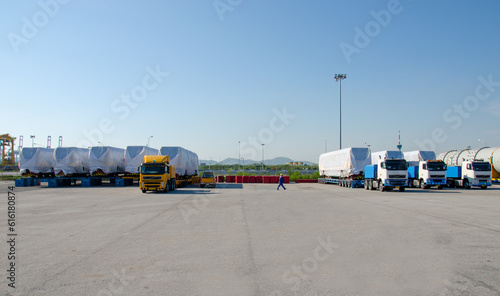Transport of Oversize Heavy Machinery cargo truck Loading a new locomotive port area