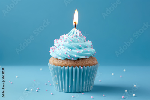 Birthday celebration cupcake with a candle on a blue background, in the style of modern, white and azure.